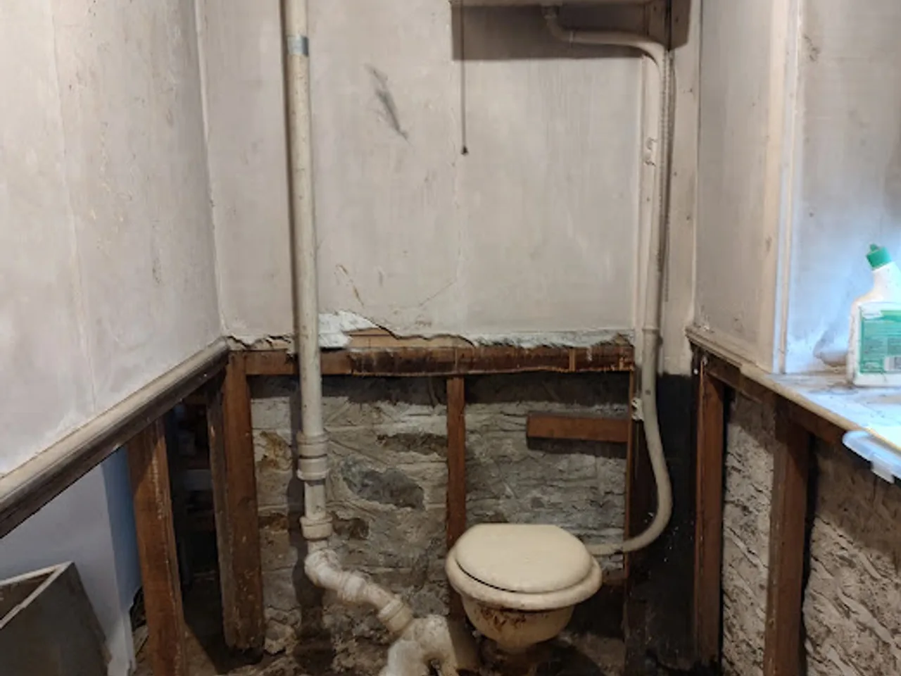 Basement half-bath build-out in Brockton, MA, before